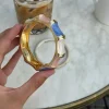 Ebony armbånd med striber - Blå/lyserød/hvid/guld
