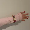 Ebony armbånd med striber - Lilla/rosa/hvid