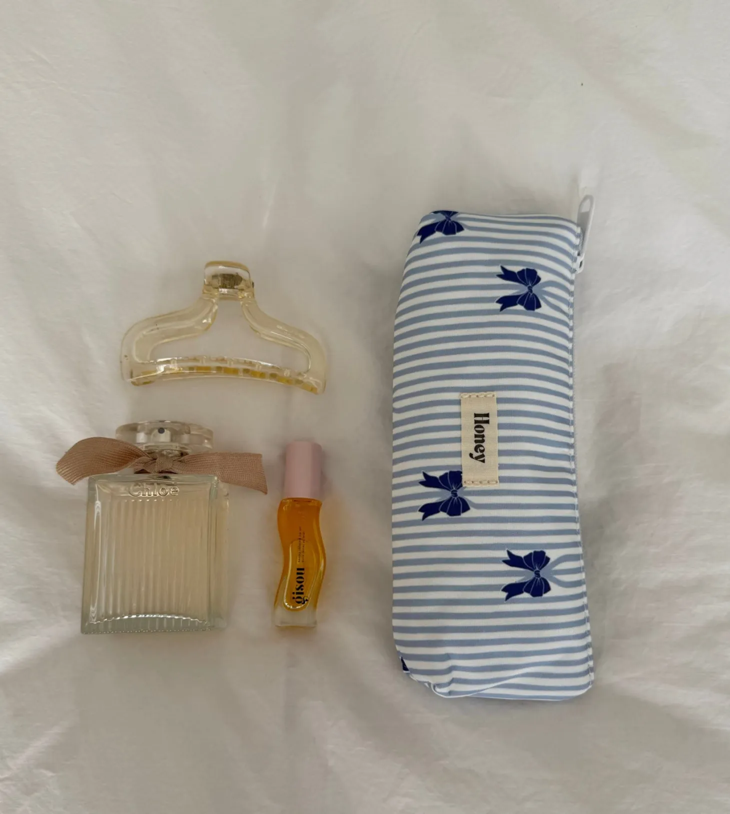Honey lille toilettaske - Hvid/lyseblå striber med blå sløjfer